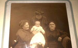 A Group of Women Holding a Baby